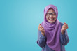 Muslim Lady Smiling with Winning Gesture