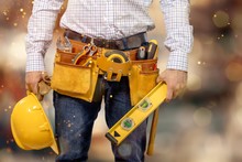 Worker With A Tool Belt. Isolated Over  Background.
