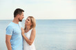© New Africa - Happy romantic couple spending time together on beach, space for text