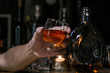 © maeching - Bartender Serve Whiskey, on wood bar,