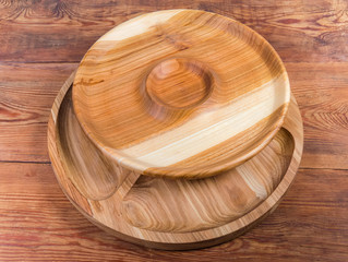 Two different empty wooden serving dish on the rustic table