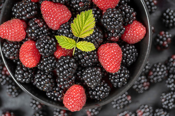 Wall Mural - Background from fresh organic blackberries and raspberries, close up. Top view blackberry and raspberry