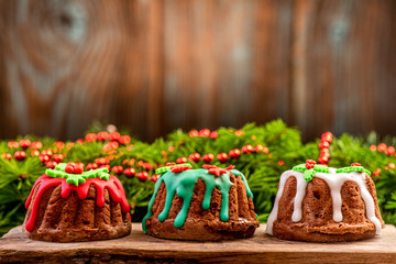 Wall Mural - Festive Christmas Cakes , Wooden Background Copyspace