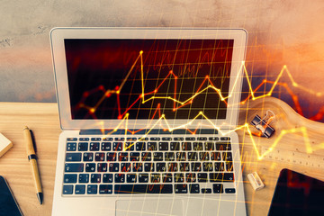 Double exposure of forex graph and work space with computer. Concept of international online trading.