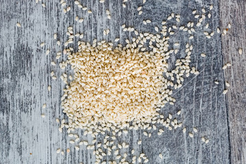 Scattered white sesame seeds