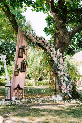 Wedding decor summer ceremony in the garden on a sunny day.