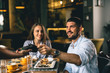 © cherryandbees - man paying for lunch in restaurant with debit card