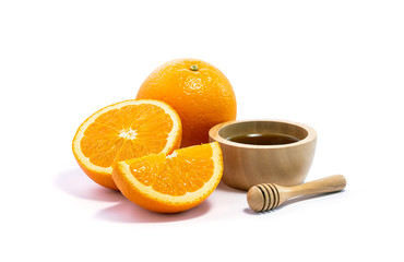 Fresh orange slice and honey in wooden bowl. isolate on white