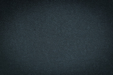 Close-up of black gray plastic material seamless texture. Surface of rough abstract dark black matte background. Design in your work backdrop, concept copy space for text.