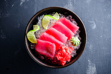 Japanese foods sashimi, Fresh raw sliced fish on black plate, Traditional Japanese food menu