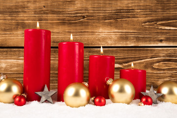 red advent candles with christmas balls