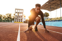 Image Of African American Man Ready To Start Running On Sports Stadium