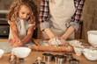 © BalanceFormCreative - Mother and daughter playing and preparing dough in the kitchen.