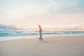 portrait of happy smiling young woman on the beach