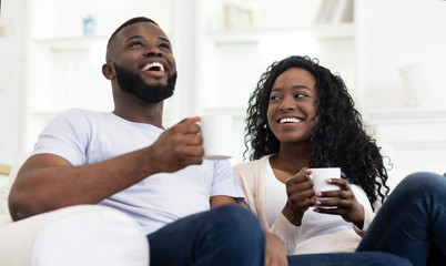 Wall Mural - Black Couple Enjoying Time Together, Drinking Coffee at Home