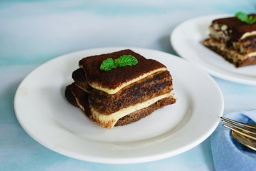 Sticker - Square slice of Tiramisu cake, selective focus