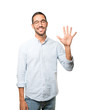 © agongallud - Young man making a number five gesture