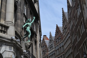 Wall Mural - Inspirational statue at the exterior of an old building in Antwerp, harbour from Belgium