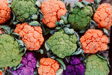 Colorful Cauliflowers, Orange, Green And Purple. Top View. Modern Food Concept Or Events