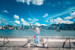 © YiuCheung - Woman traveling in Hong Kong City