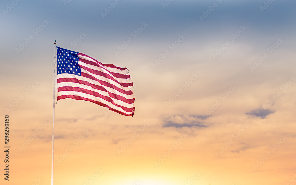 Obraz na płótnie American flag blowing in the wind against beautiful sunset. w salonie