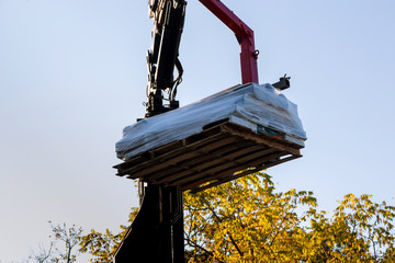 Canvas Print - Heavy machinery is used the roof construction material house extension