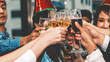 © Mongkolchon - group of diversity businesspeople making toast together in corporate new year celebration party
