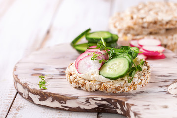 Toast with cheese, a cucumber and a garden radish