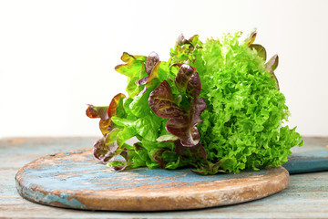 Sheet salad on a wooden rustic background . Selective focus. Copy space