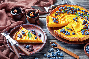 Wall Mural - sliced pumpkin pie topped with fresh blueberries