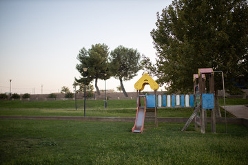 Green area with children's playground with slides