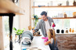 © zinkevych - Dark-haired young man cleaning kitchen with daughter