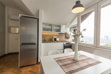 Kitchen interior with dining area in loft apartment