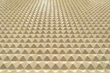 Poster - Triangle pyramid tiles pattern surface texture. Close-up of architecture interior material for design decoration background.
