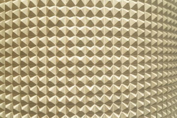Poster - Triangle pyramid tiles pattern surface texture. Close-up of architecture interior material for design decoration background.