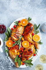 Wall Mural - roasted chicken with tangerines, cranberry and spicy herbs for Christmas dinner