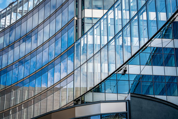 Modern office building with reflection in windows