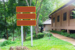 © AlivePhoto - Copy space tourist information sign in National park, Empty direction sign board in park