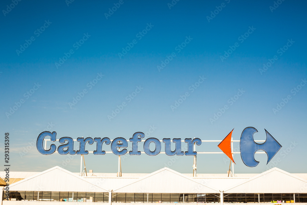 Carrefour supermarket chain brand logo at building Stock Photo | Adobe ...