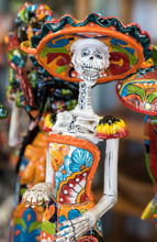 La Calavera Catrina -Mexican Colorful Traditional Souvenirs. The Symbol Of The Holiday Of The Day Of The Dead. Ceramic Pottery Day Of The Dead, Dia De Los Muertos, Skulls.
