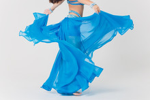 Portrait Of Belly Dancer Girl In Blue. Isolated On White.