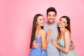 Wall Mural - Portrait of cheerful man women with long foxy ginger haircut cuddling smiling wearing striped dress skirt t-shirt isolated over pink background