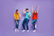 © deagreez - Full body size length photo of company of three inspired person having fun and free time demonstrating victory isolated violet background