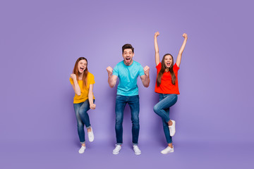 Canvas Print - Full length size body photo of cheerful enthusiastic positive mad having fun triumph and luck three glad people gesturing hands raising fists up isolated violet background