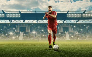 Wall Mural - Soccer player in action. Run with a ball. Soccer stadium with cheering fans