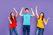 © deagreez - Portrait of nice attractive lovely cheerful cheery glad successful lucky guys wearing colorful t-shirts jeans denim celebrating best cool attainment isolated over violet lilac background
