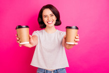 Photo Of Cheerful Cute Nice Charming Attractive Sweet Girlfriend Smiling Toothily Proposing You Choice Of Two Coffee Kinds Wearing Grey T-shirt Jeans Denim Isolated With Pink Color Vivid Background