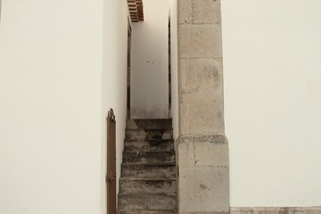 A narrow stairway between two buildings (Madeira, Portugal)