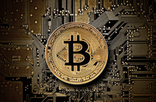 Bitcoin Golden Coin On Computer Circuit Board 