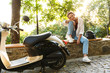© Drobot Dean - Lovely young girl casually dressed sitting on a bench
